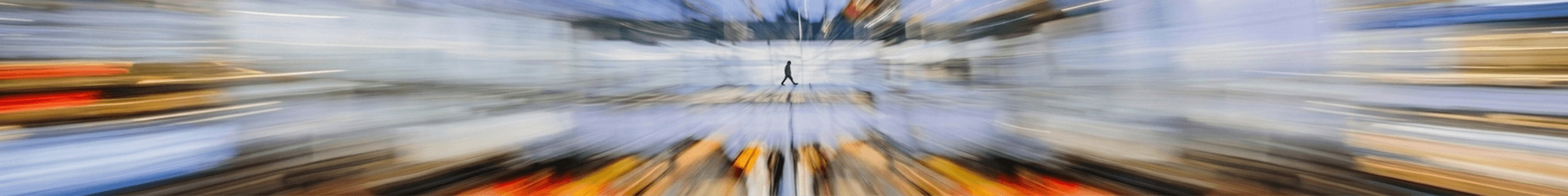 A person walking through a space of moving light